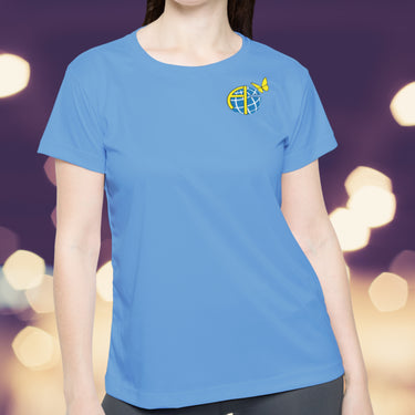 Women’s sport jersey with Anakainoo International logo, breathable moisture-wicking fabric with globe and butterfly design symbolizing spiritual transformation and renewal through intimacy with God, woman wearing light-blue sport jersey
